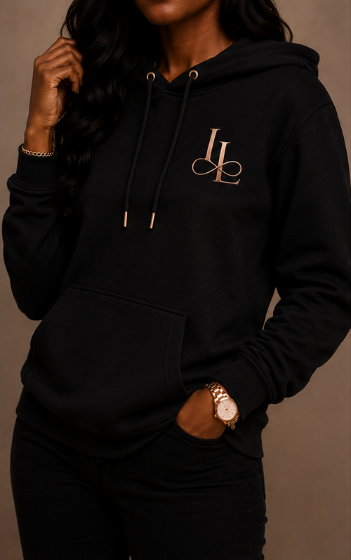 Black hoodie with 'Elegance' text on the back, worn by a person against a neutral background.